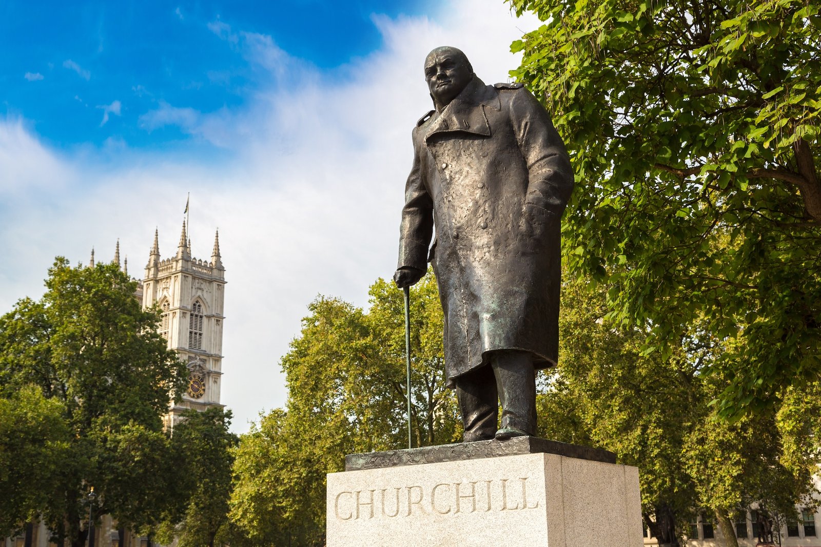 Statue of Winston Churchill in Parliament Square in a beautiful summer day, London, England, United Kingdom