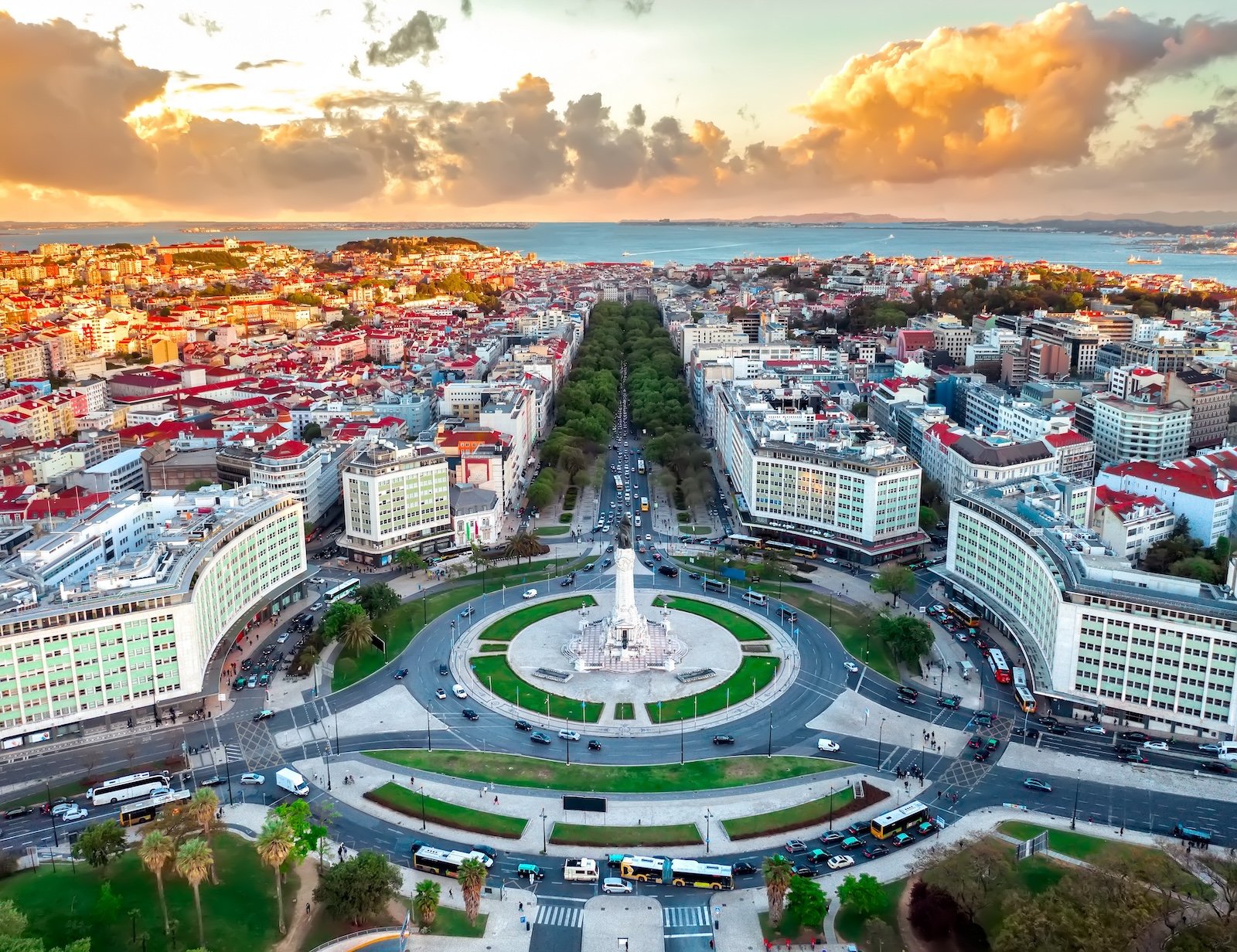 Lisbon aerial skyline panorama european city view on marques de pombal square monument, sunset outside crossroads portugal